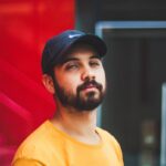 selective focus photography of man wearing Nike dad hat
